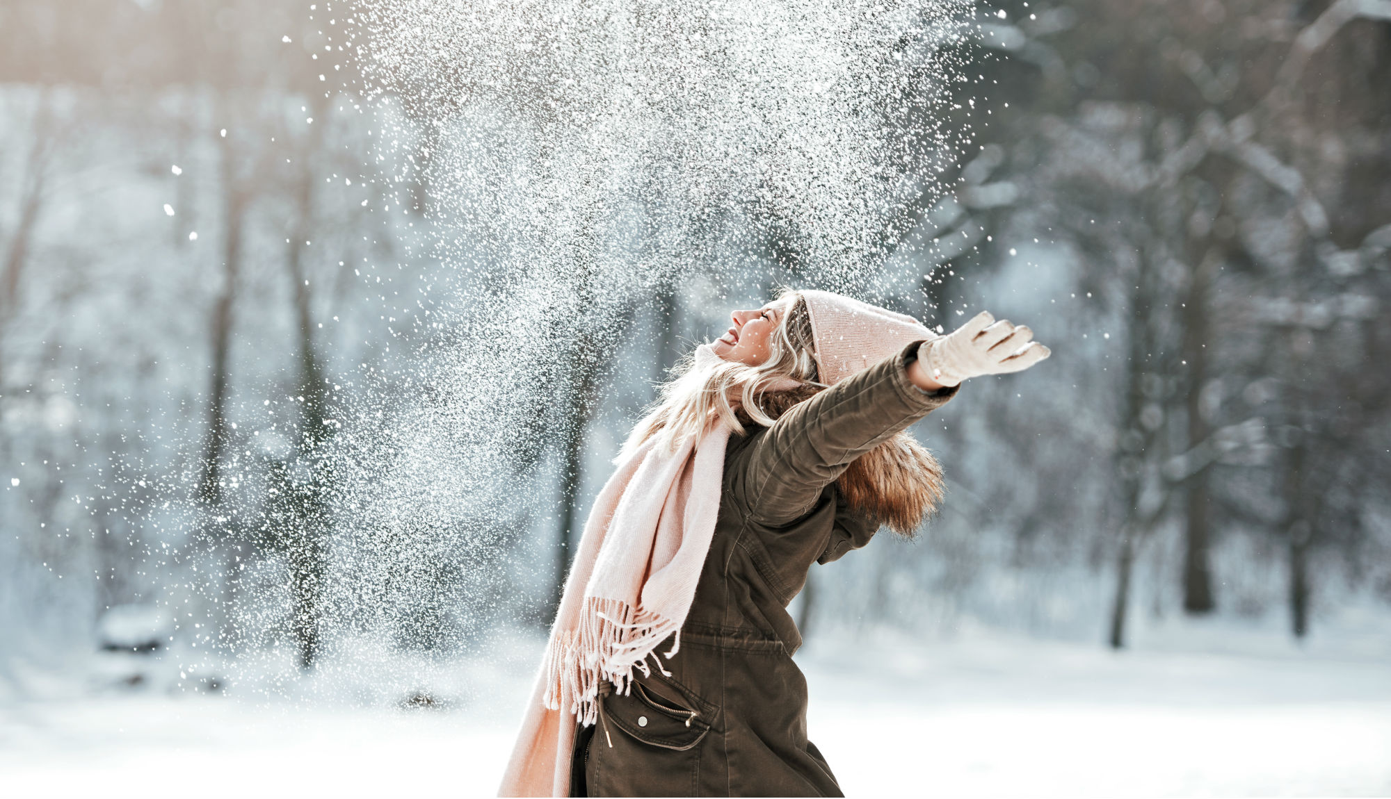 Woman playing in snow